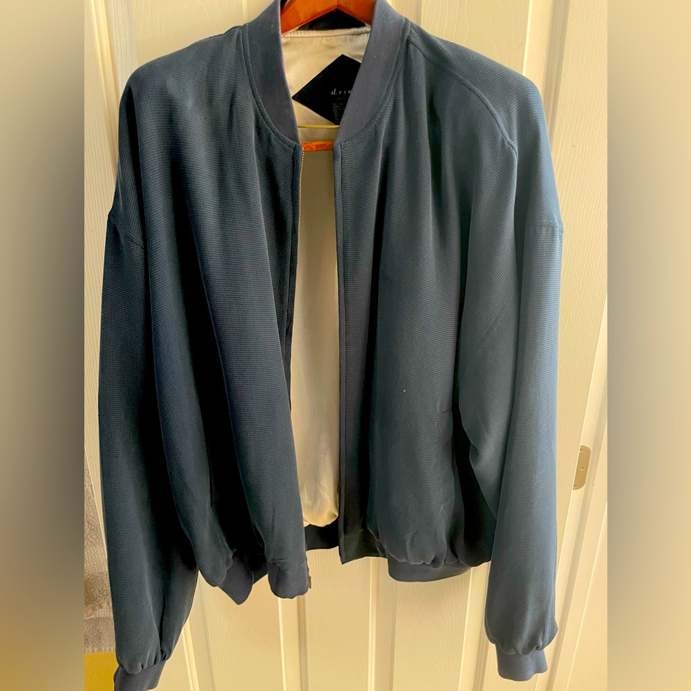A vintage unworn soft blue fine silk bomber jacket from D.Fine Las Vegas